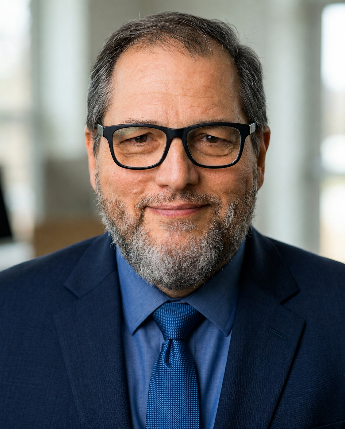 Professional headshot of Tom Backus